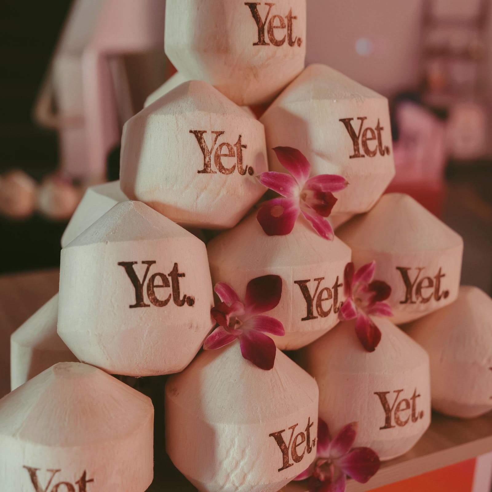 Stack of YET-stamped coconuts at a lululemon event