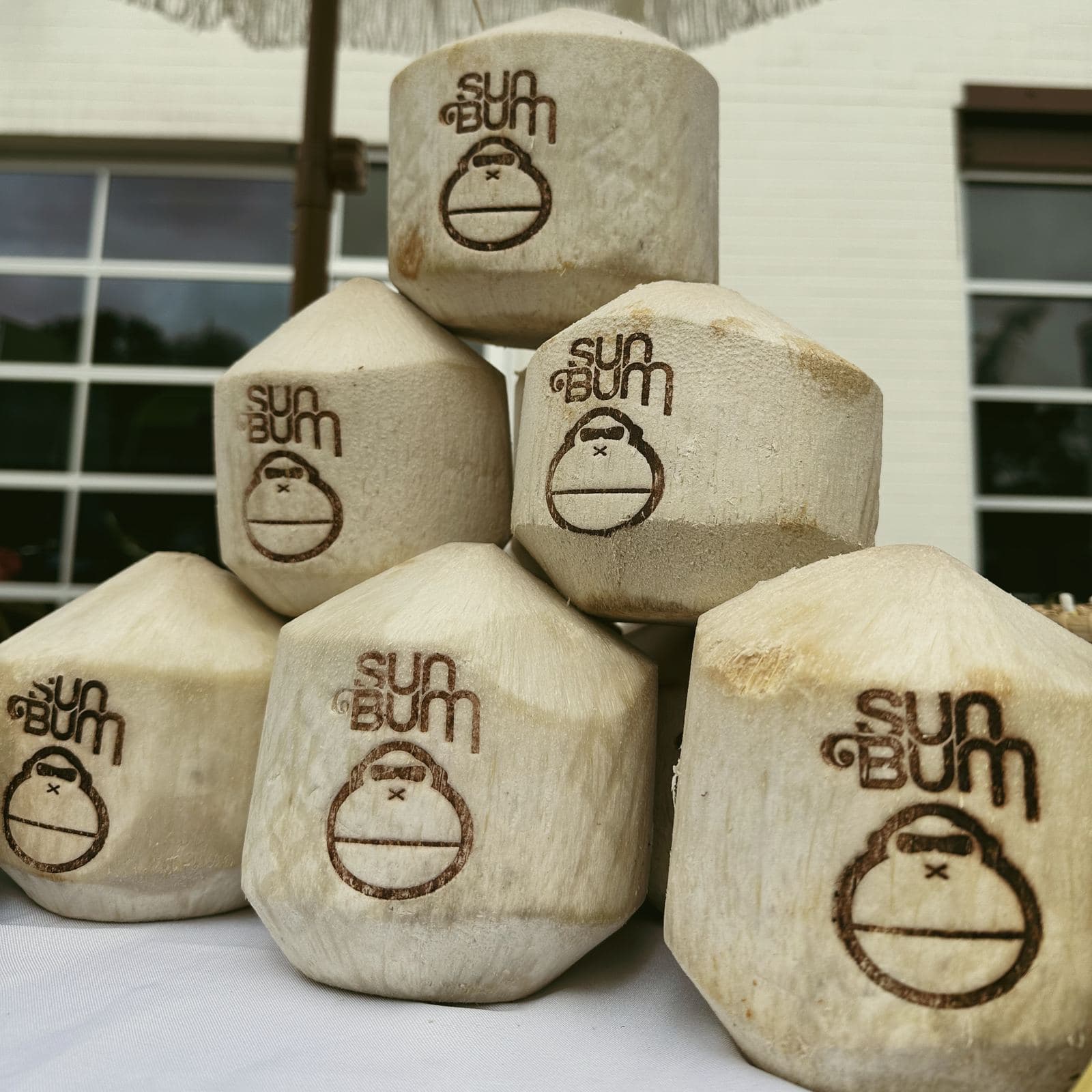 Pyramid of Sun Bum-stamped coconuts