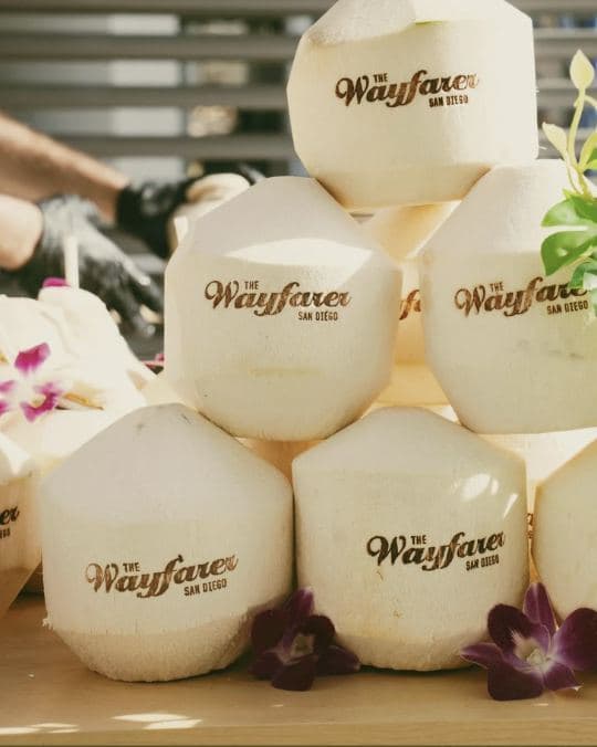 Stack of coconuts stamped for The Wayfarer