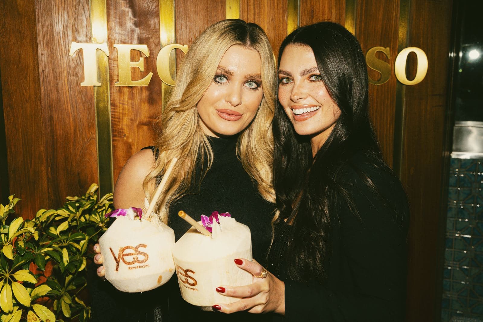 Guests with Yes-stamped coconuts at the Yes app launch party